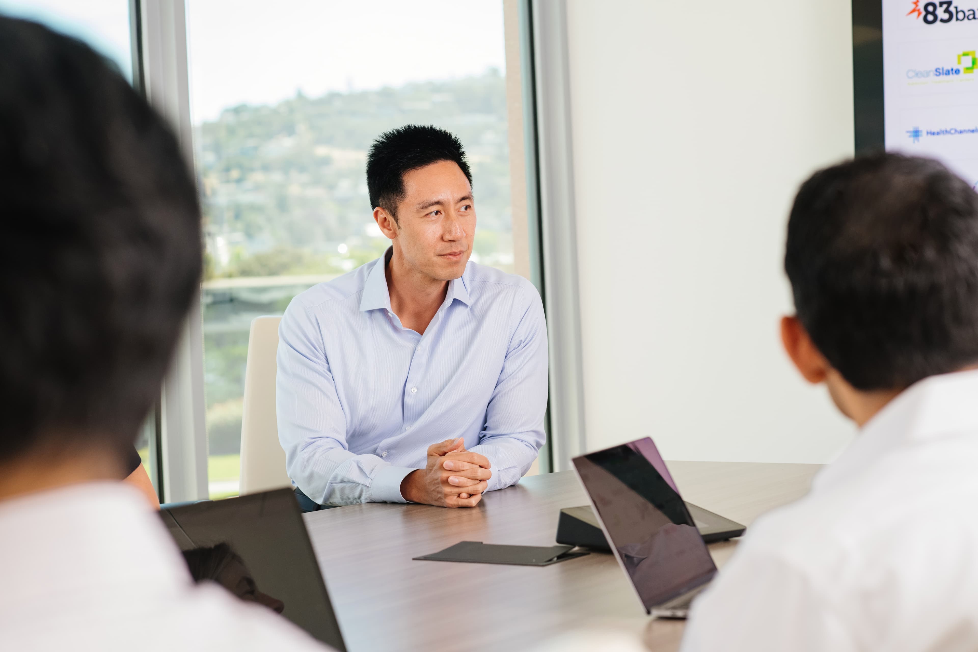 man leaning on a desk