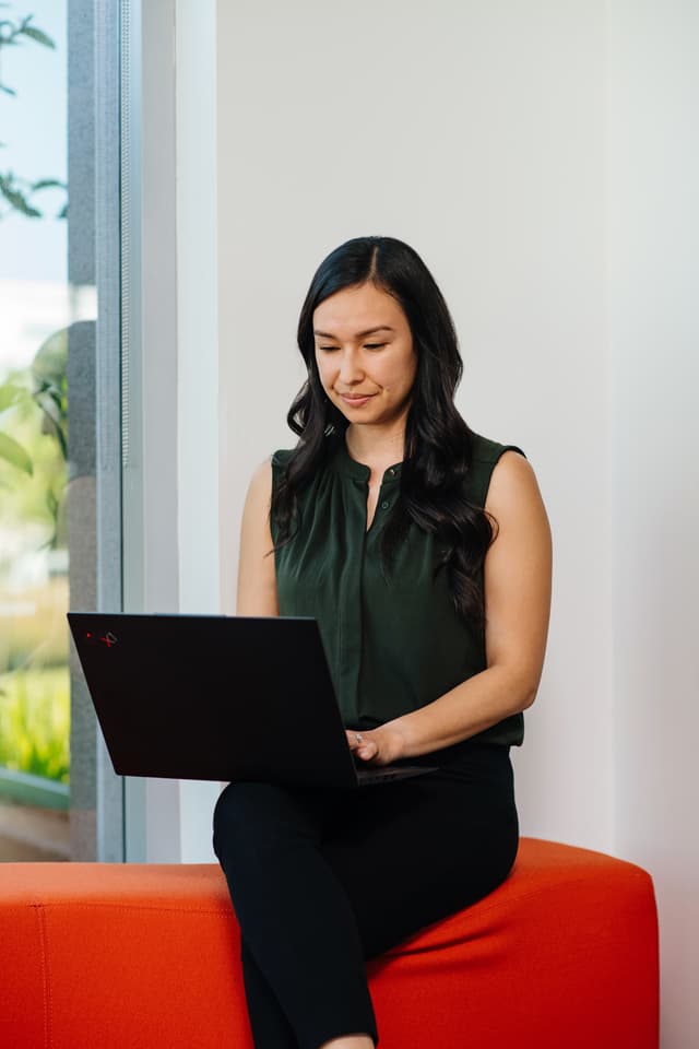 woman on her laptop on a sofa